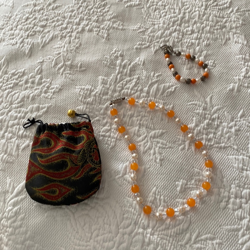 Necklace with bracelet and pouch